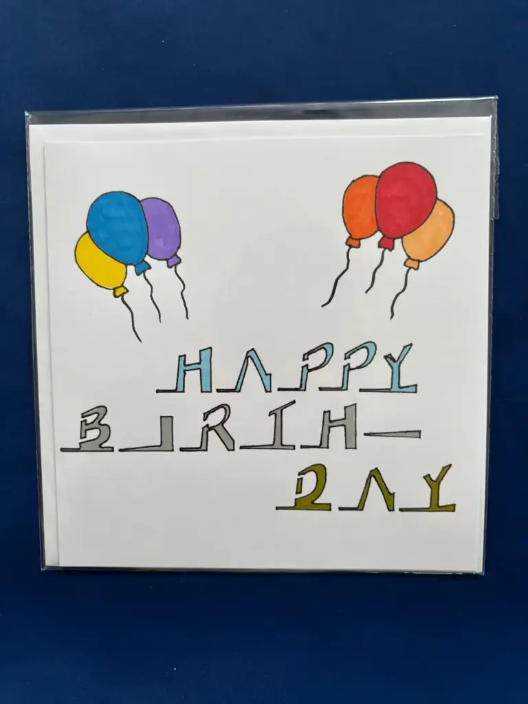 Geburtskarte mit farbigen Luftballone